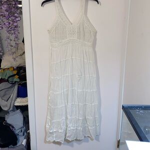 Medium white maxi dress with crochet designs and strings to sinch the dress
